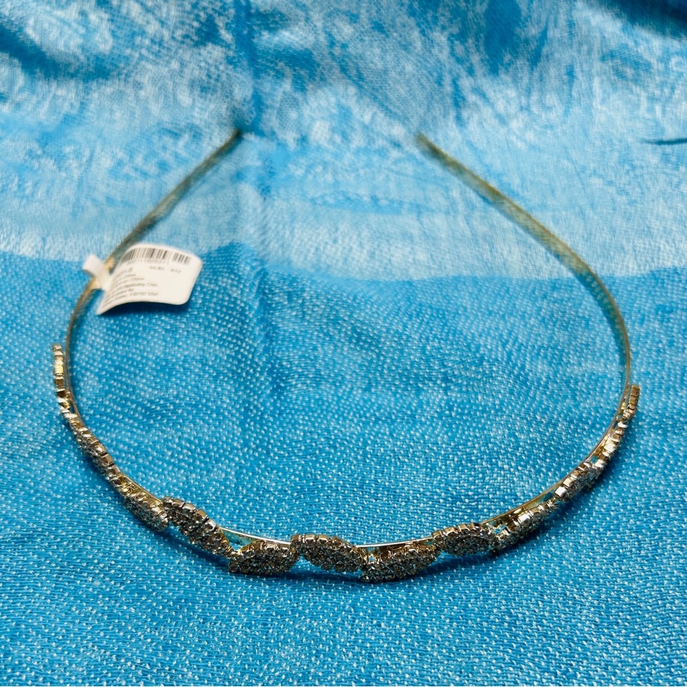 Headband, NWT, silver with rhinestone leaves. Small adult, will fit child.